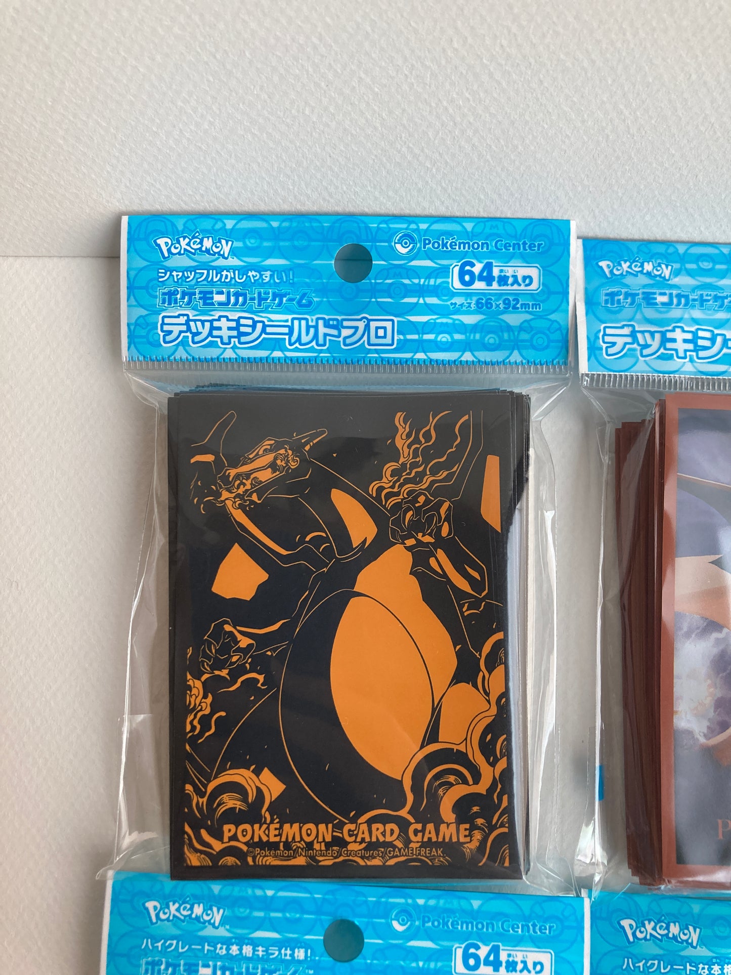 Set of 9 Pokemon TCG Sleeves Deck Shield Mixed Lot Packs of 64 Pokemon Center Japan Official Charizard, Sylveon